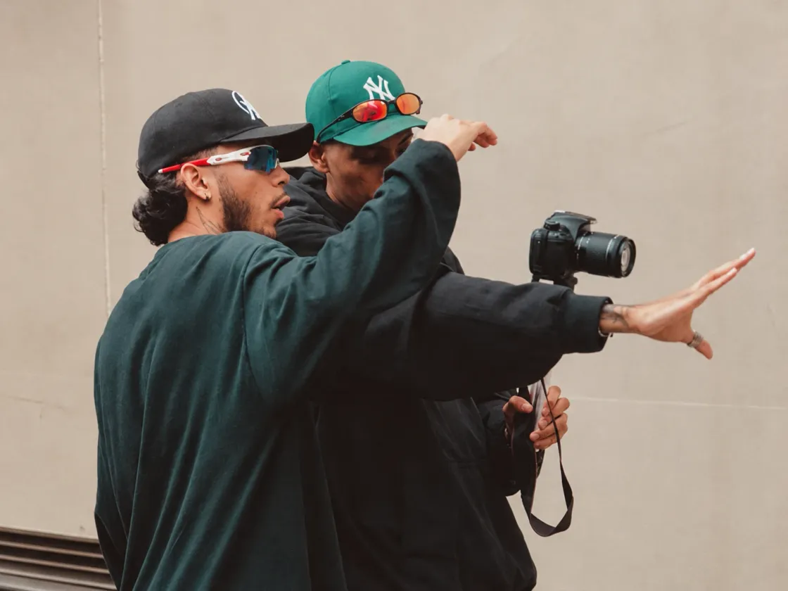 Two people on a shoot, one of them holding a camera