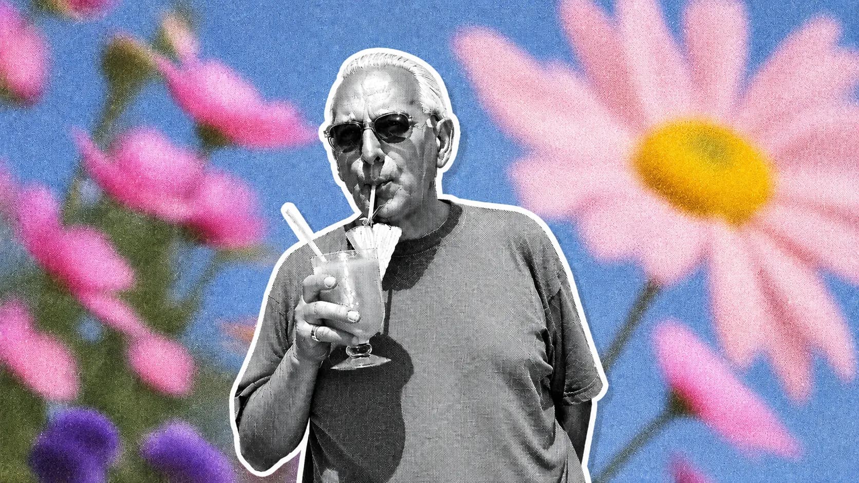 A relaxed man sipping a drink surrounded by flowers