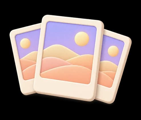 Three printed photos of a sunset landscape, fanned out