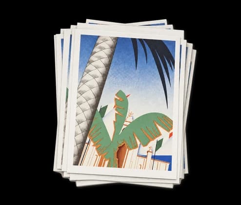 Une pile de tirages d'art d'une illustration de palmier