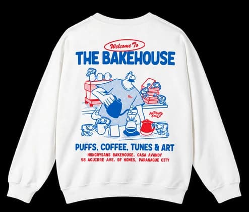 Un sweat-shirt blanc imprimé d'une illustration de boulangerie